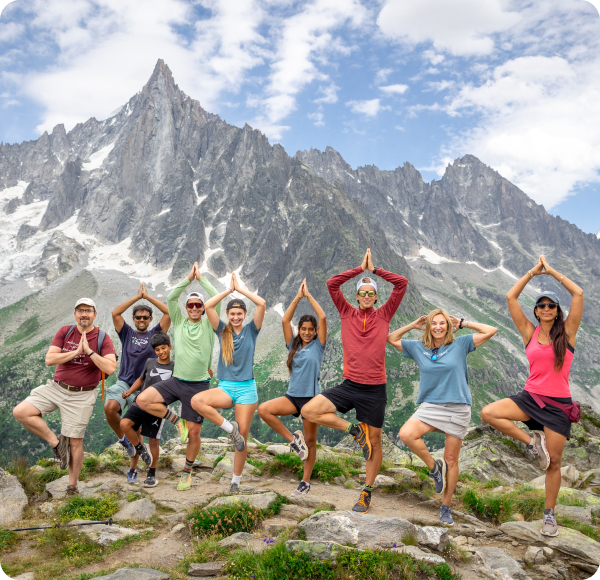 Family doing yoga poses in the French & Italian Alps