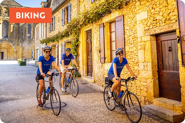 text: biking; image: guests biking on trip