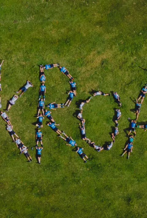 aerial view of backroads employees spelling out backroads! with their bodies