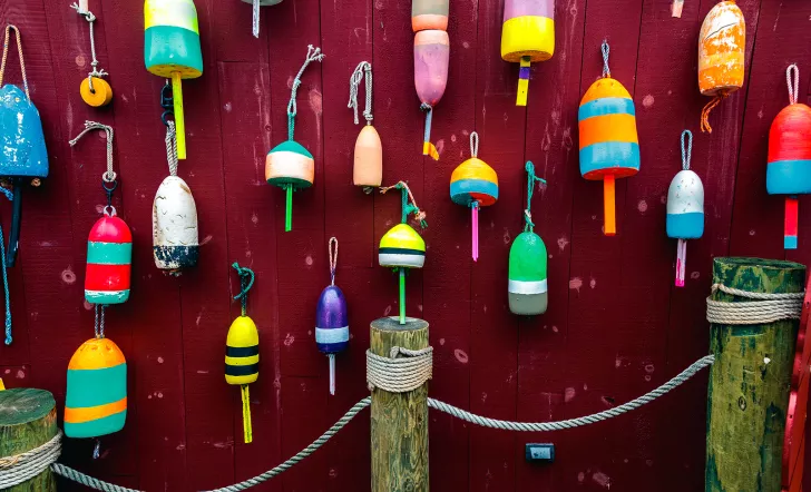 Wall of different colored buoys.