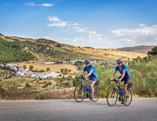 Two bikers riding on a road in southern Spain.