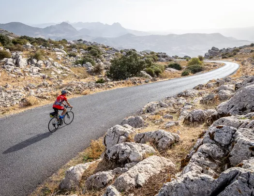 Biker riding on a road in Spain.