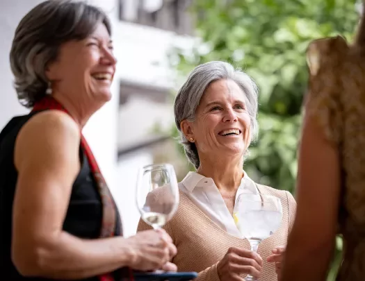 Two women having a glass of wine.