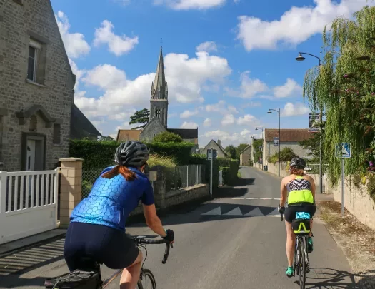 Two Backroads Guests Biking Through Town in Brittany/Normandy