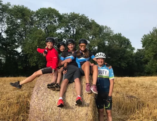 Five Backroads Guests Smiling on a Rock