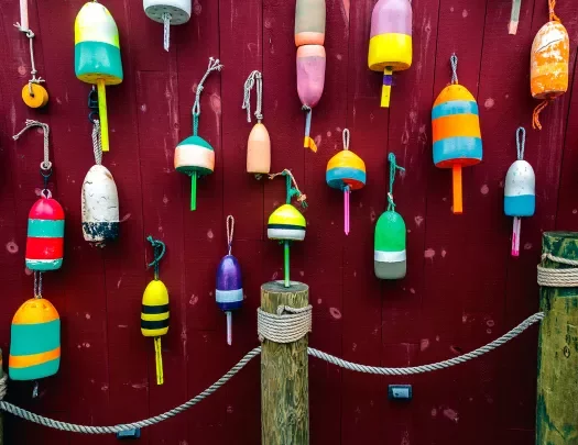 Wall of different colored buoys.