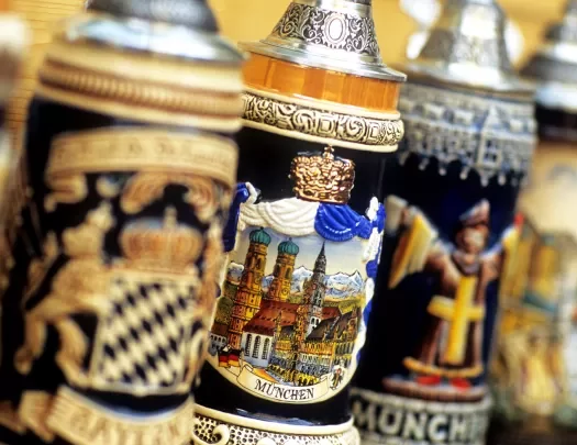 Ceramic beer steins in a row.