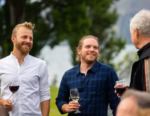 3 Men Talking and Drinking Wine in New Zealand