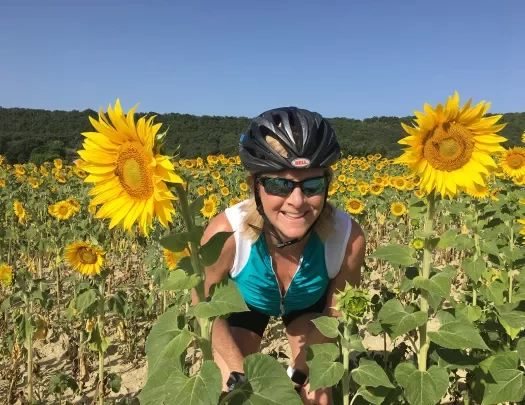 Backroads Guest Smiling in Sunflowers