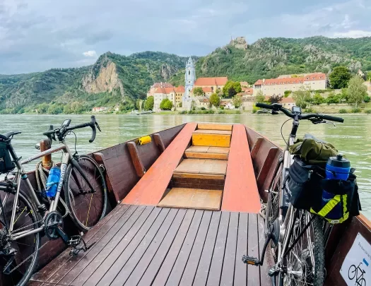 Two Backroads bikes loaded onto a boat on the water.