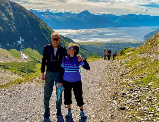 Guests on gravel path in the mountains