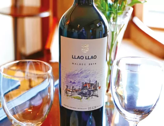 Shot of Liao Liao wine bottle, empty glasses.