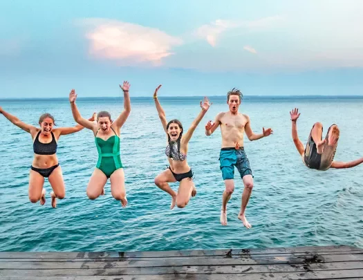 Guests Jumping Off of  Dock Belize