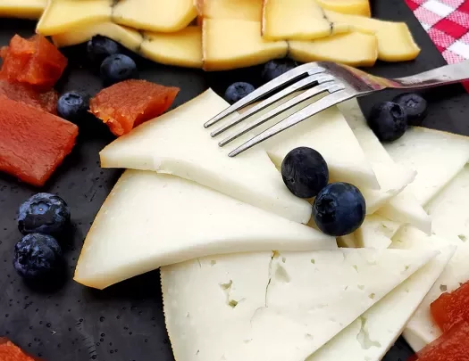 Close-up of cheese and fruit platter.