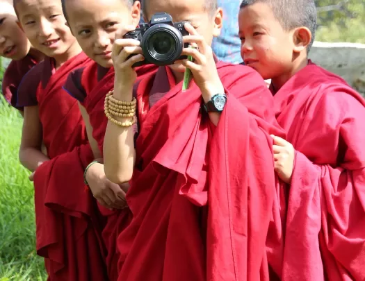 Group of young monks with a camera