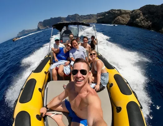 Selfie of guests on large, moving dinghy.