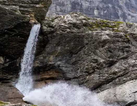 Wide shot of craggy waterfall.