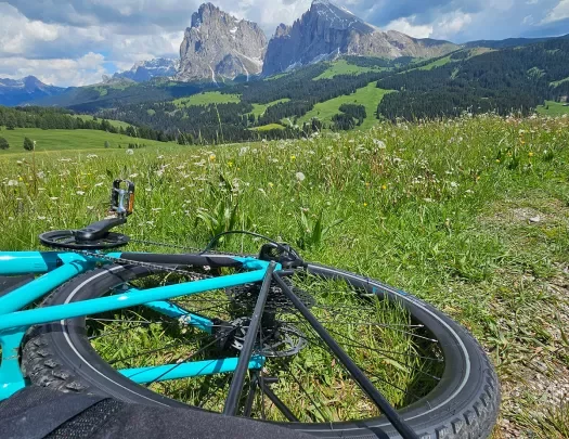 Point of view shot of the Dolomites, Backroads bike in foreground. 