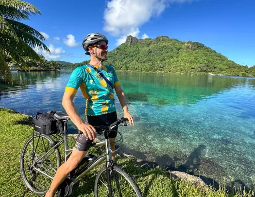 Riding a bike next to a bay in Tahiti