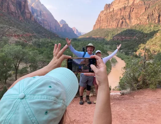 Guests getting photo taken in Zion