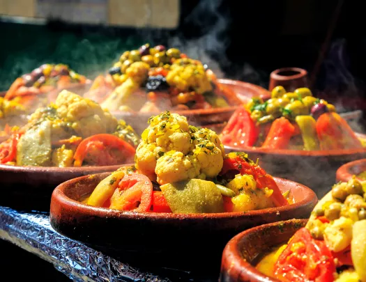 Assorted bowls of steaming food.