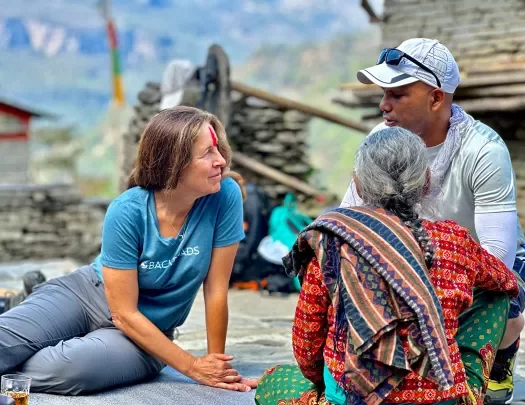 Backroads guests chatting with a local in Nepal