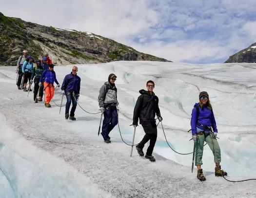 Walking along an icy glacier in Norway