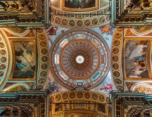 Shot of ceiling in domed church, mosaics and art on ceiling. 