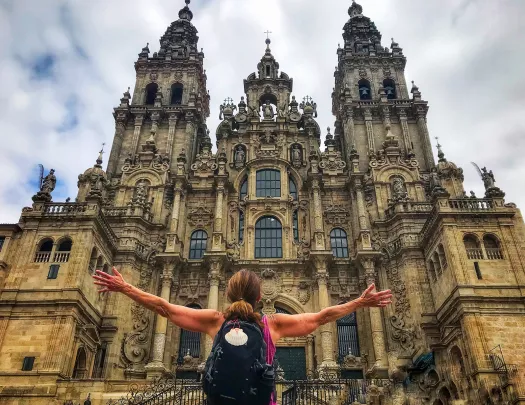 Woman enjoying the façade of the Cathedral of Santiago