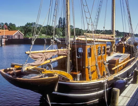 Small ship docked at a port 