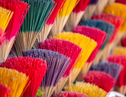 Vendor stall full of colorful incense sticks