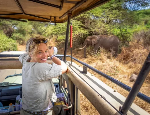 a guest takes a photo on safari