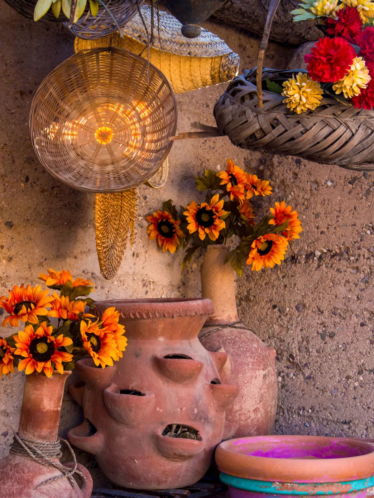 Corner with clay pots filled with flowers and plants