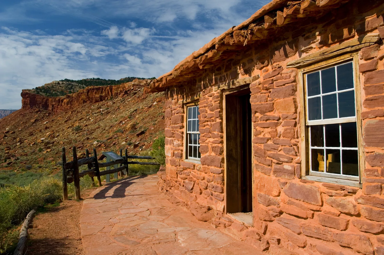 Red brick building in the middle of a rocky valley