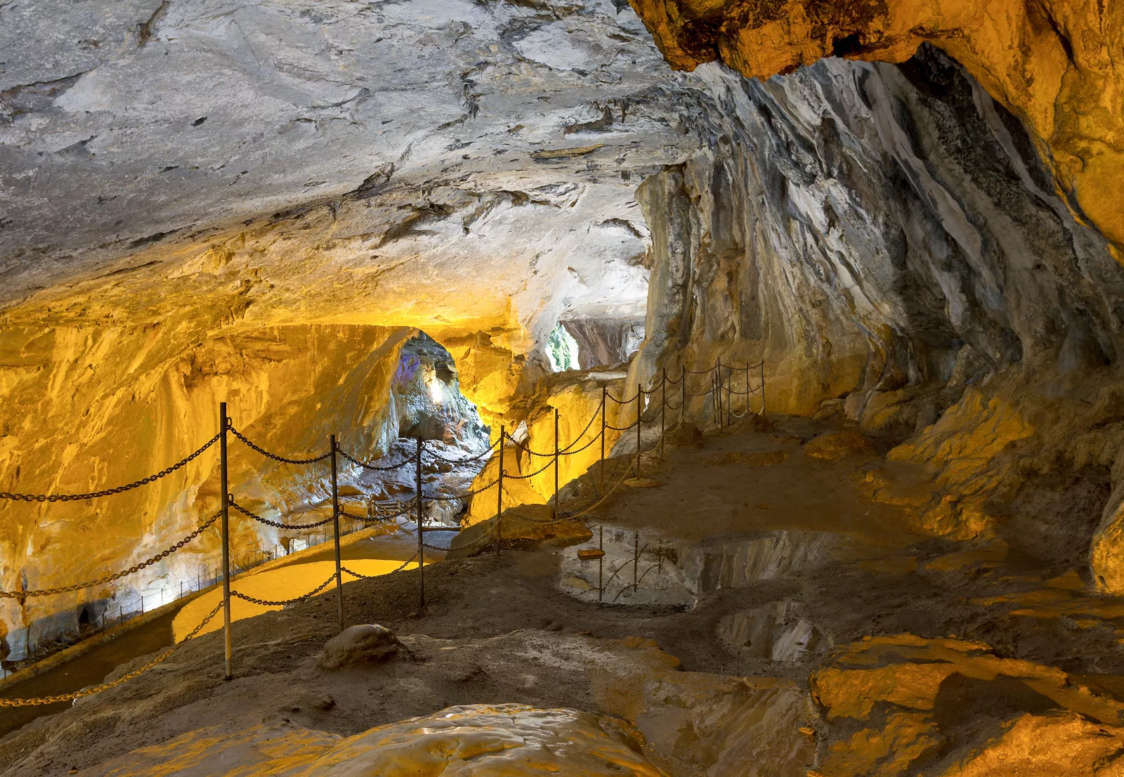 Cave illuminated by orange lights