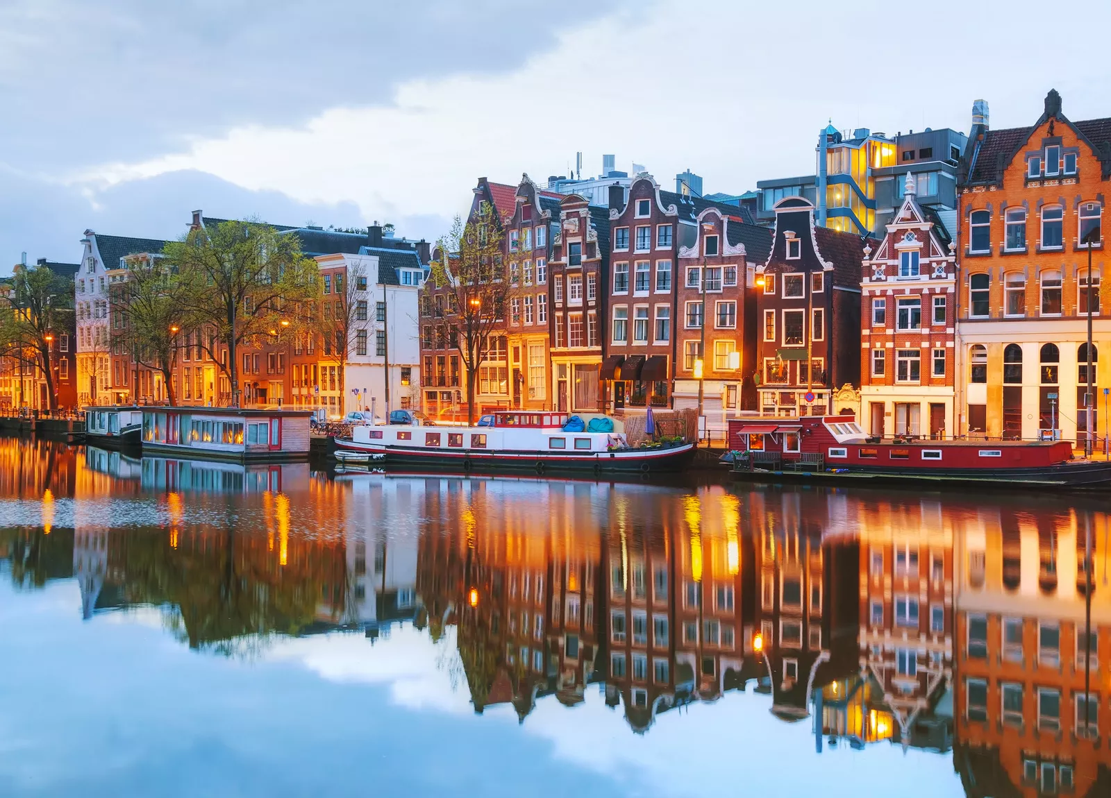 Houses lit up along a canal