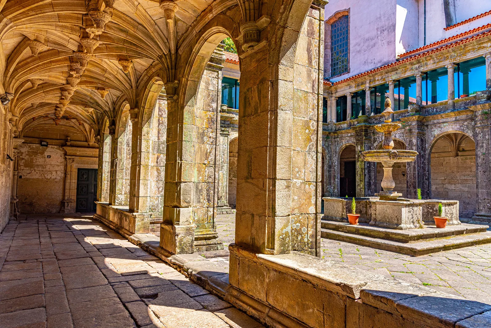 Ancient building courtyard with pillars and a fountain