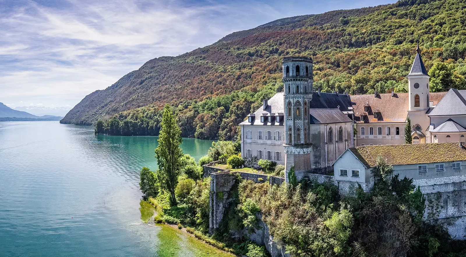 Rustic, church-like building elevated in the middle of the ocean