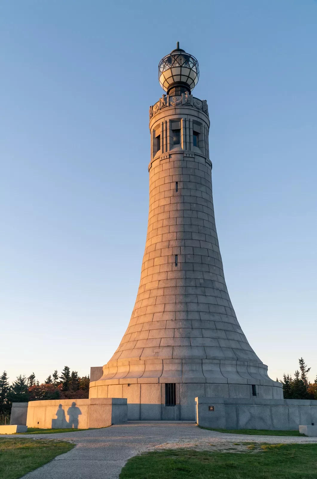 Sunset hitting a stone lighthouse