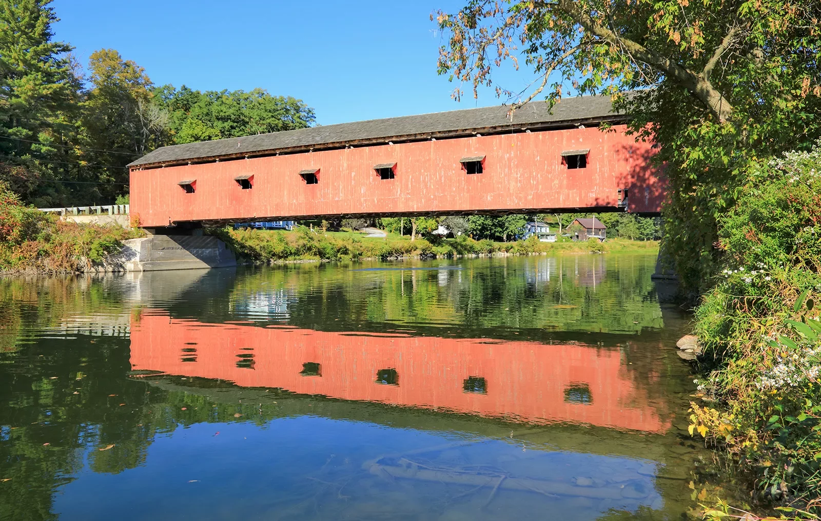 Red bridge over a river