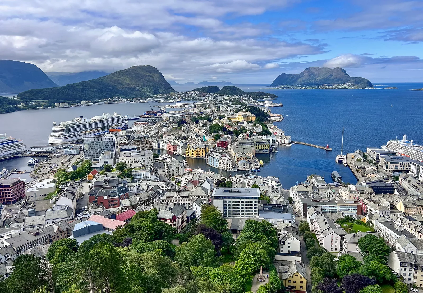 White buildings scattered across a town, surrounded by the ocean