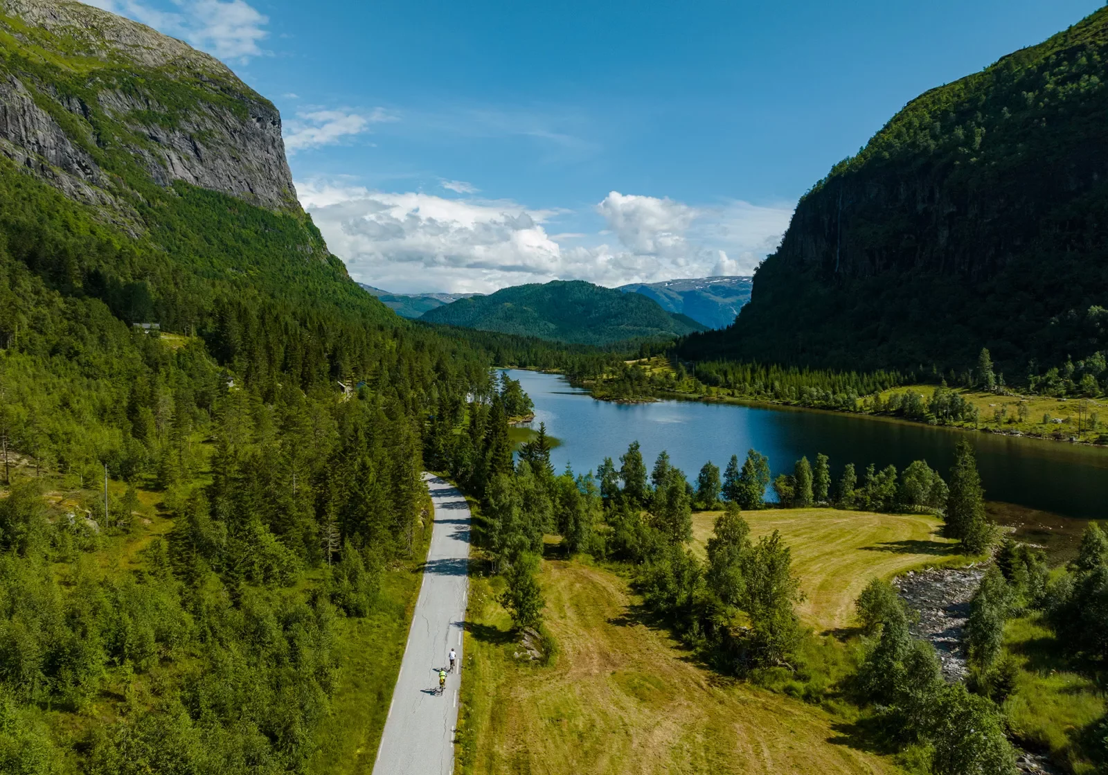 Bird's eye view of a rode winding through a river valley