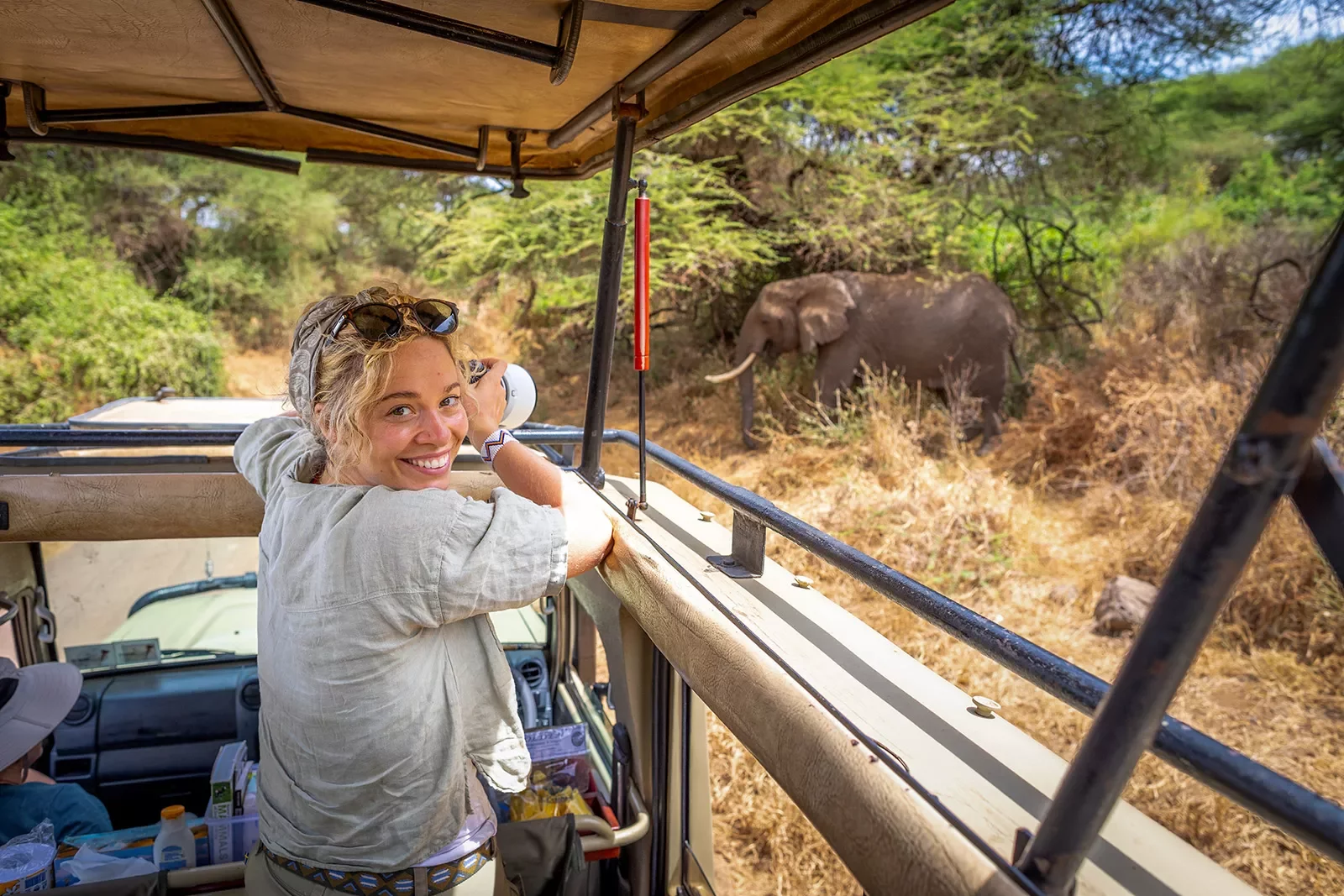 a guest takes a photo on safari