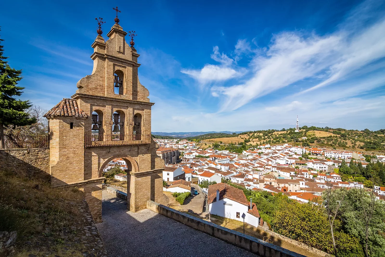 Rustic bell tower overlooking a small town