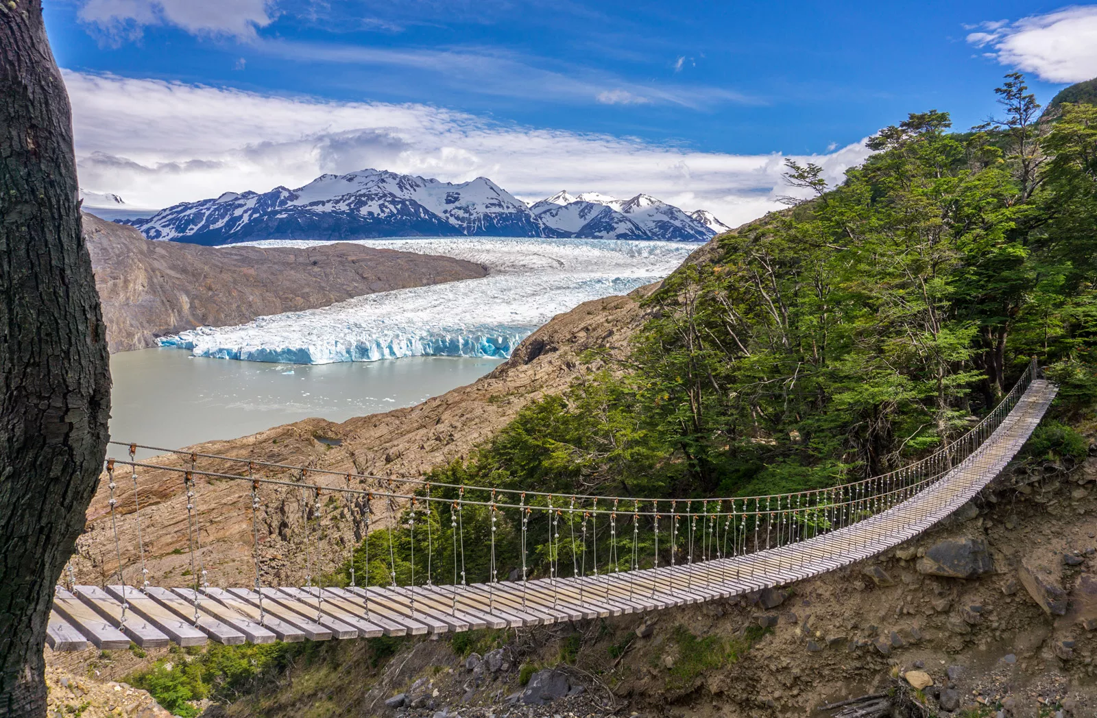 Wooden bridge connecting two dirt cliffs