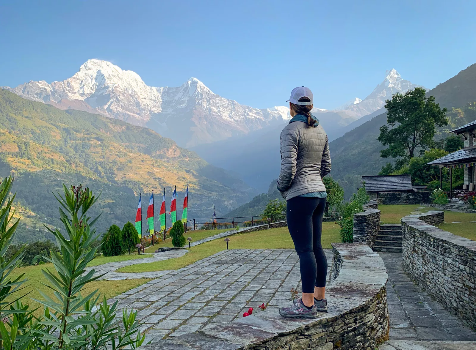 Woman overlooking hills and mountains in the distance