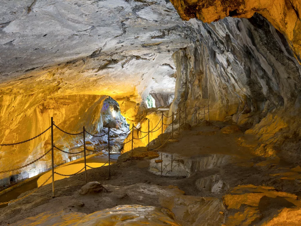 Cave illuminated by orange lights