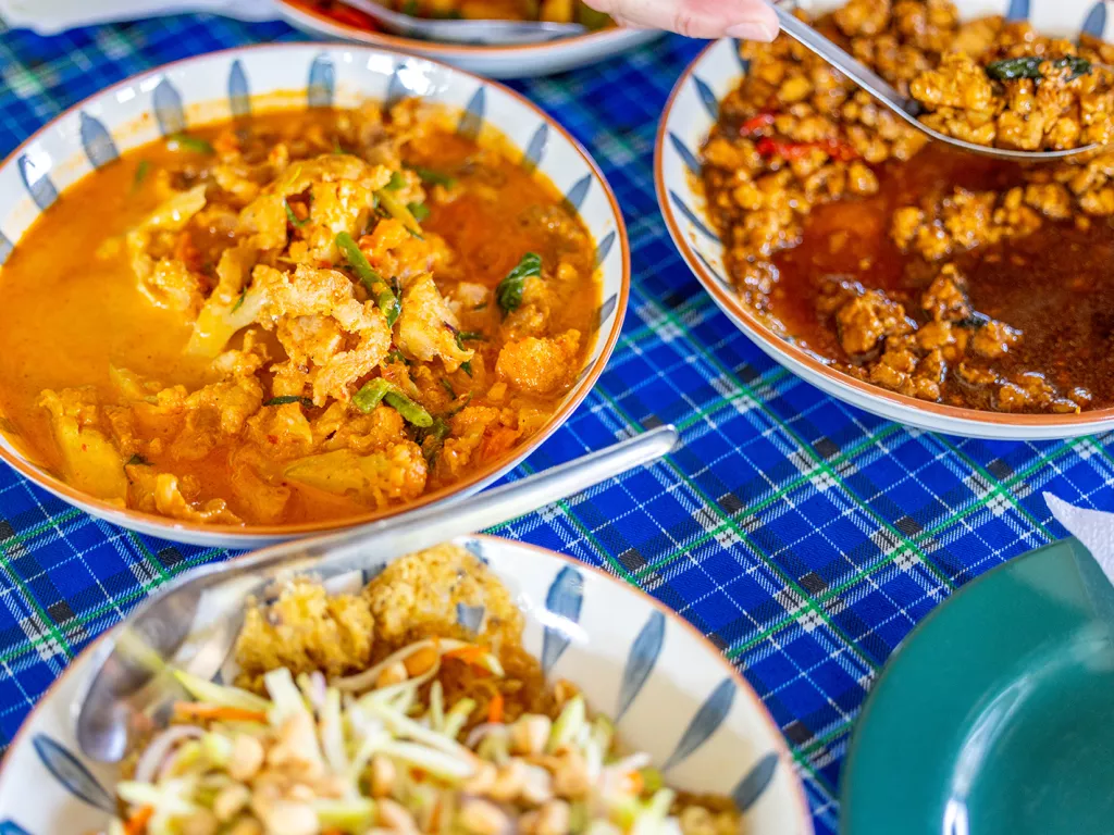 Bowls of food on a blue checkered table