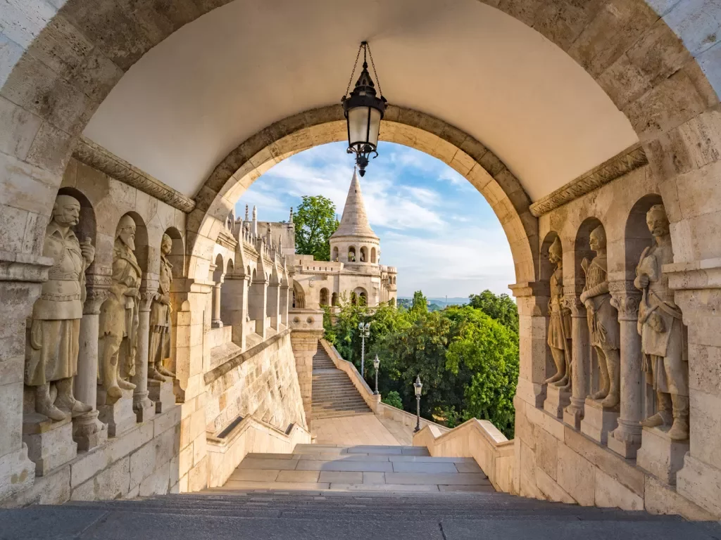 Rustic pathway with stairs and carved statues