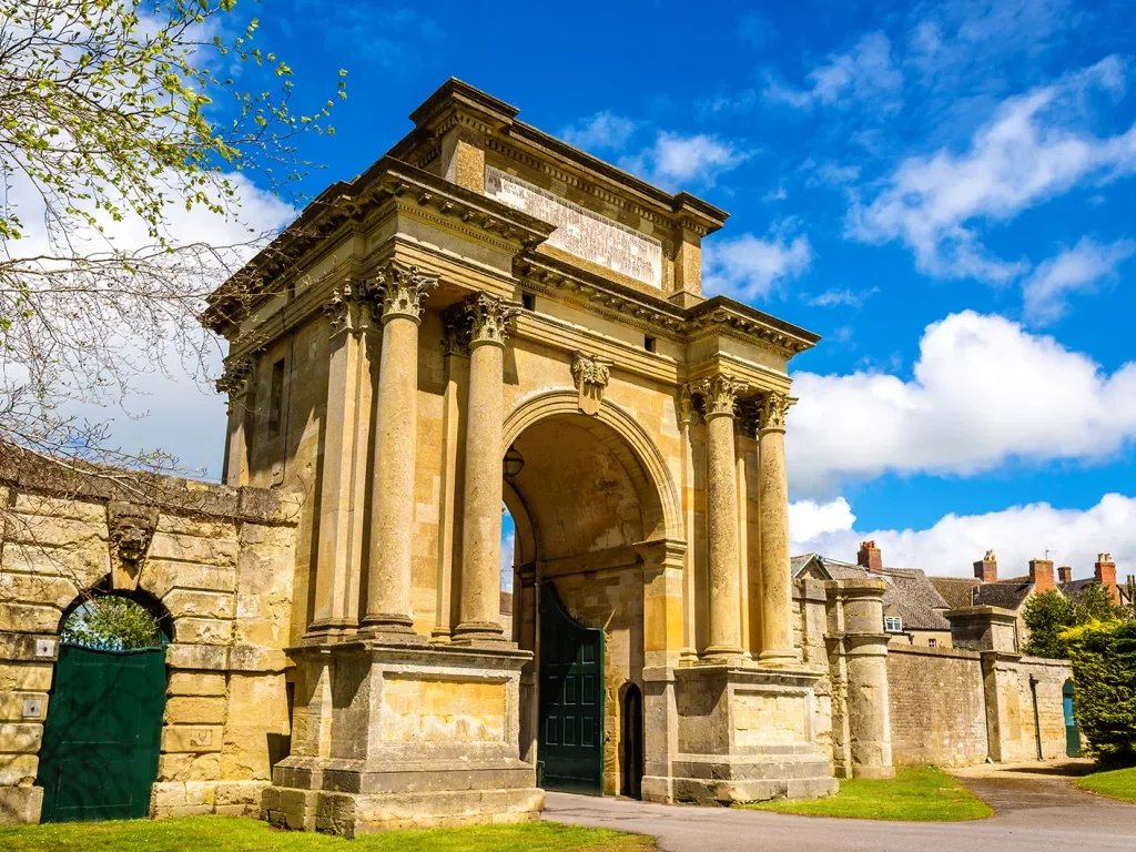 Rustic, yellow arc with large pillars connected to it